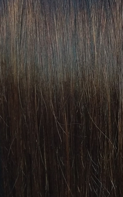 Close up image of LUSHIERE clip in hair extensions in brunette colour #2 chocolate brown taken in natural light