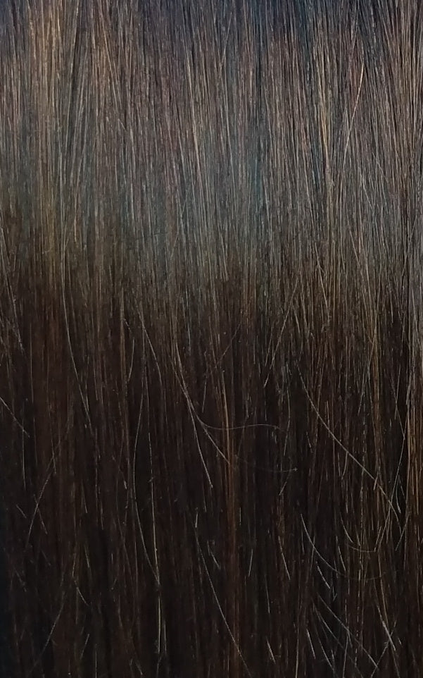 Close up image of LUSHIERE clip in hair extensions in brunette colour #2 chocolate brown taken in natural light