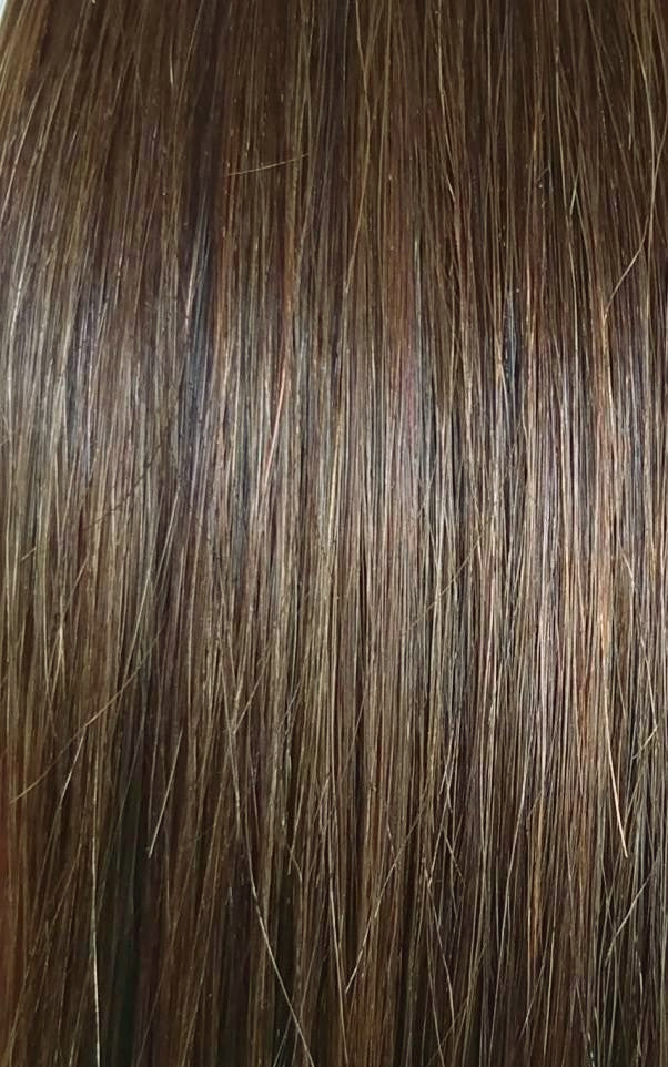 Close up image of LUSHIERE clip in hair extensions in chestnut brown colour #4 taken in natural light