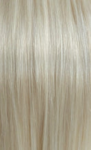 Close up image of LUSHIERE clip in hair extensions blonde colour #60 platinum white blonde taken in natural light