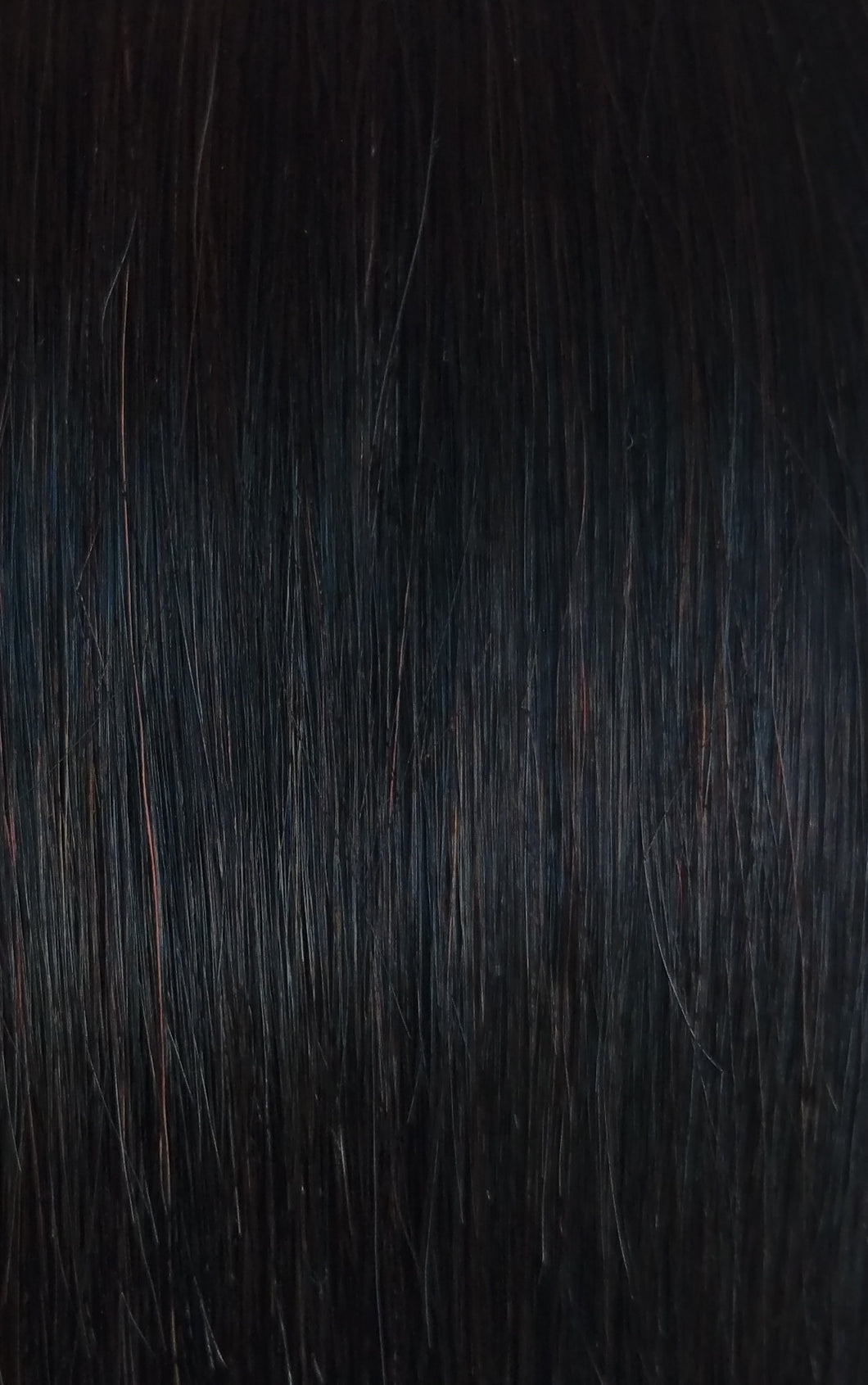 image of natural black LUSHIERE clip in hair extensions with warm undertones