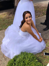 Image of customer in debutante dress wearing hair halfup-halfdown hair style adding extra volume by wearing LUSHIERE clip in hair extensions in brunette brown colour #4 chestnut brown
