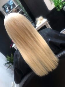 Image of customer from behind wearing LUSHIERE clip in hair extensions in blonde colour #60 platinum blonde 